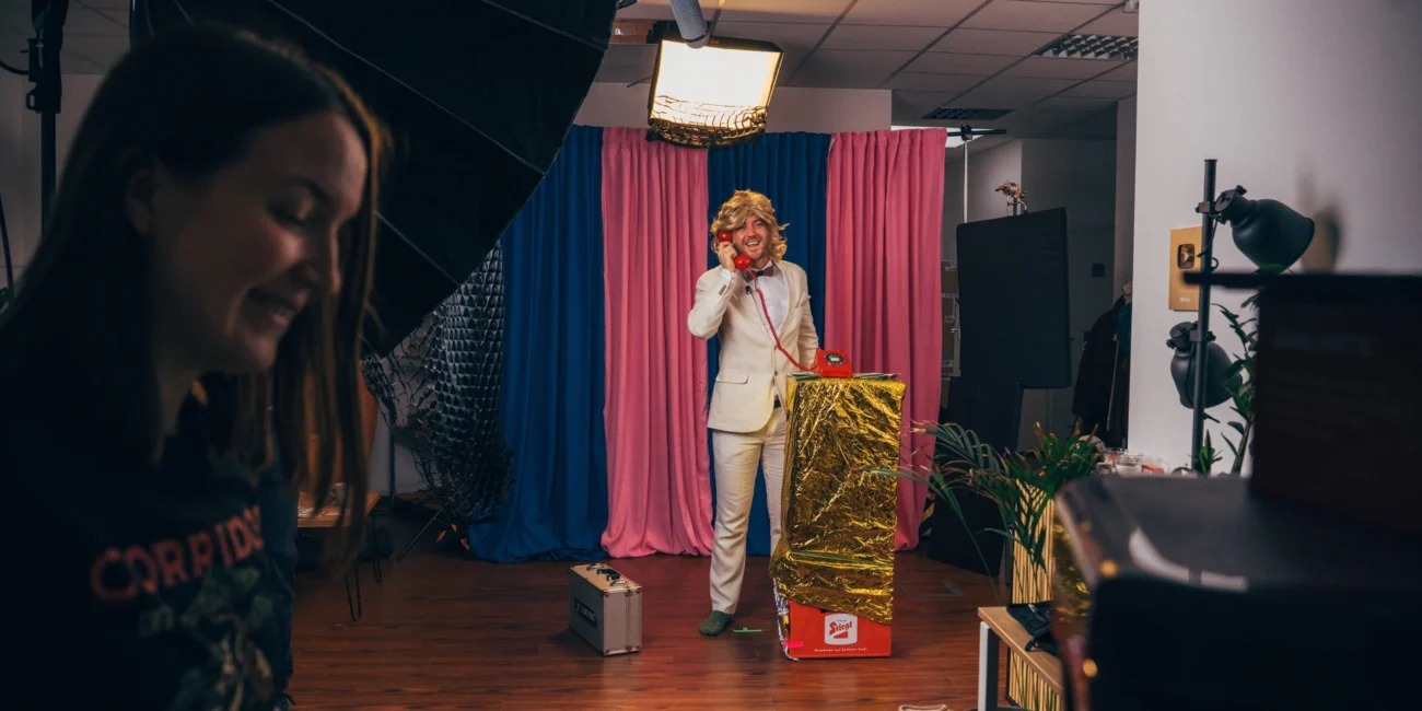 The Holy Moly Films crew setting up cinematic lighting for a comedy sketch, highlighting the technical production process.