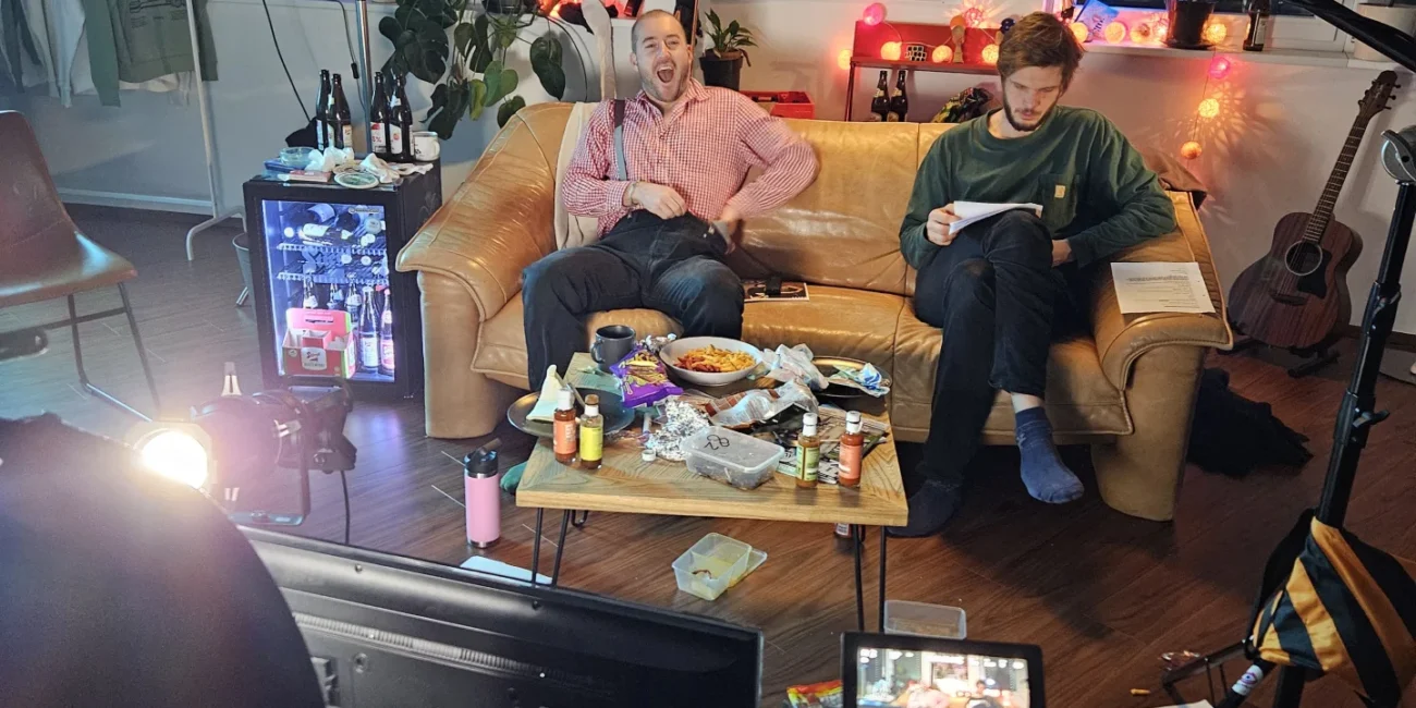 Comedian Austrian Kiwi and the Holy Moly Films production team during a break, capturing the creative energy of the shoot.