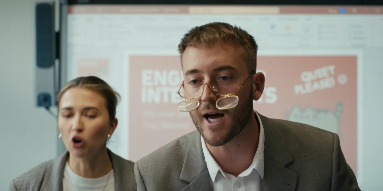 Creators AustrianKiwi and thisisstevie playing English teachers in a Holy Moly films comedy sketch.
