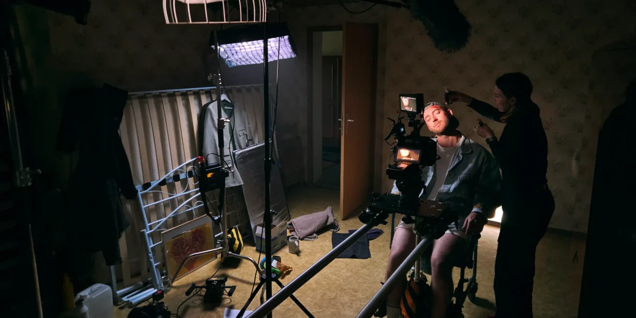Behind-the-scenes look at professional camera gear and a camera slider setup on a short film set by Holy Moly films in Austria.