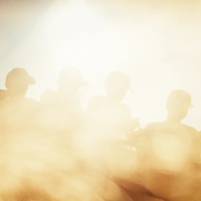 Silhouettes of the Perwein team against the backlight, equipped with the new Naked Optics sunglasses for outdoor work.