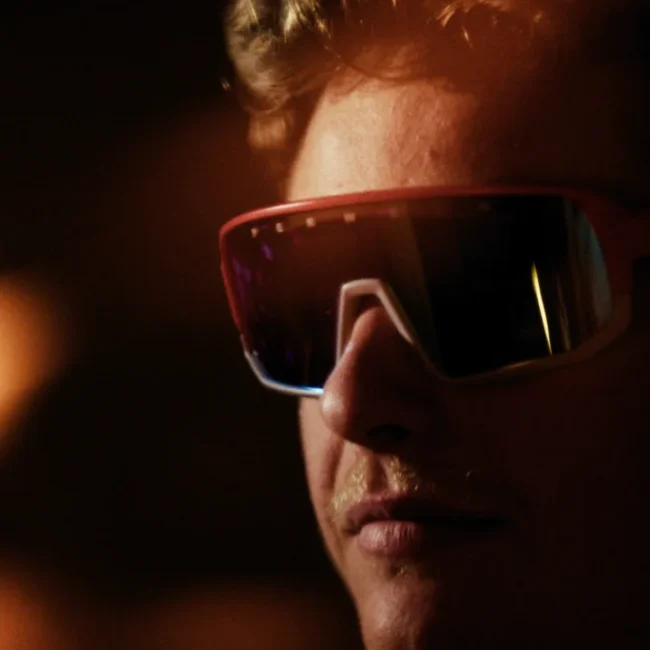 Craftsman wearing the stylish Perwein x Naked Optics sunglasses in warm lighting, ideal as sun protection for outdoor work.